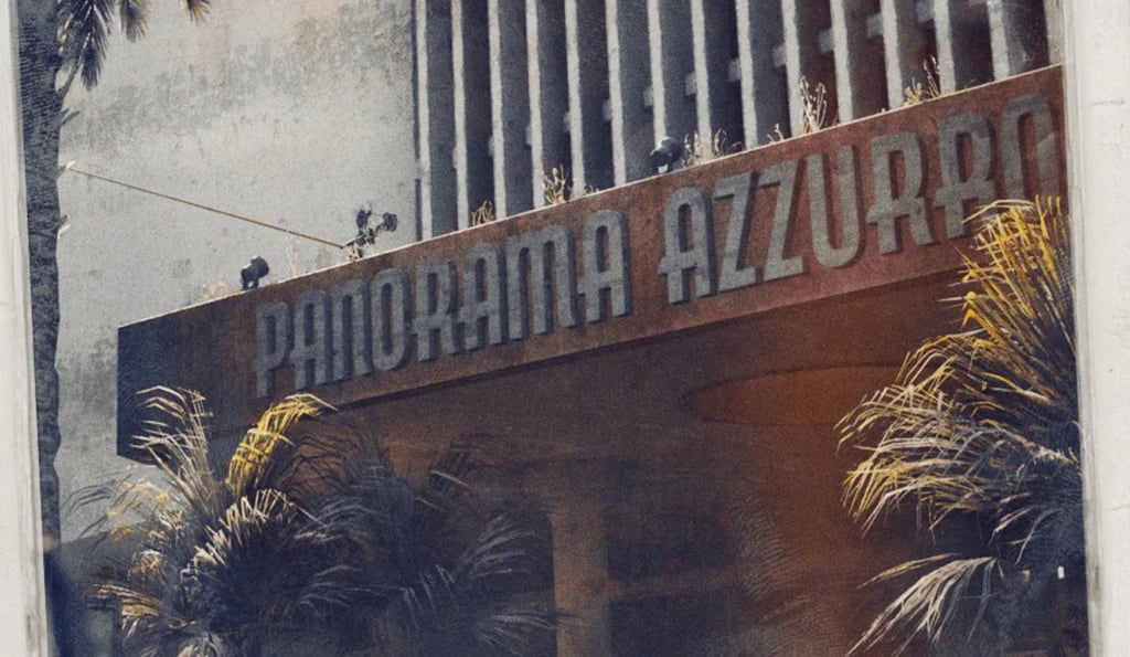 Die beigefügten Polaroid-Fotos zeigen das „Exodus Hotel" – ein mehrstöckiges Gebäude mit dem Schriftzug „Panorama Azzurro" – sowie ein zerstörtes Interieur.